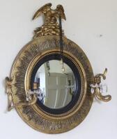 A Regency gilt framed convex girandole mirror