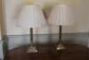 A pair of brass table lamps of Corinthian columnar form