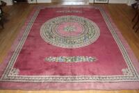 An Axminster pink ground Empire design carpet