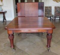 A Victorian mahogany wind-out extending dining table