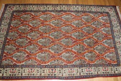 A Qum bordered rug