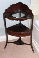 A George III inlaid mahogany corner washstand