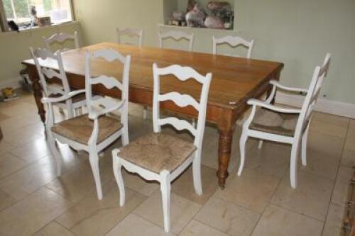 A set of eight French style painted ladder back chairs