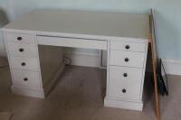 A white painted kneehole dressing table