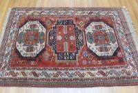 An Eastern bordered red ground rug