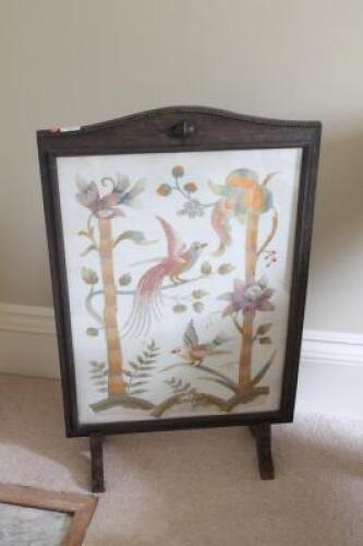 An oak framed needlework firescreen