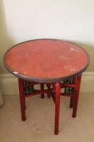 A Benares circular tray top table with folding base