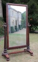 An early Victorian mahogany cheval dressing mirror