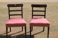 A pair of Regency dining chairs.