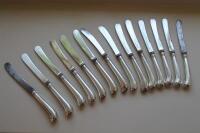 A set of eight tea knives