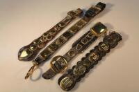 Four Martingales with small horse brasses attached.