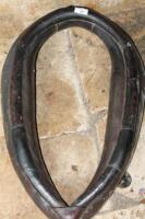 A black leather horse collar