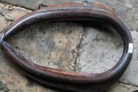 A brown leather horse collar