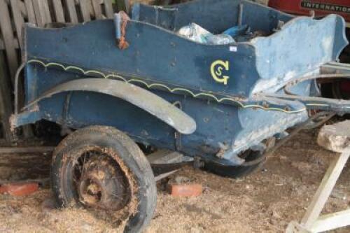 A two wheel horse trap painted in blue (AF).