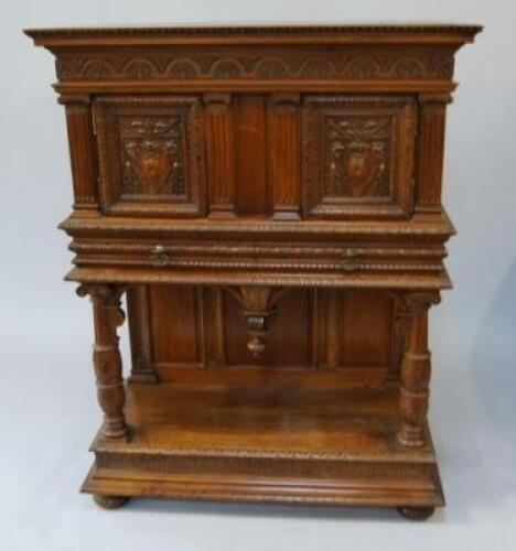 A continental walnut sideboard/court cupboard