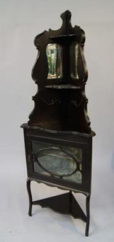 A late Victorian ebonised corner unit