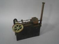 A live steam engine with single fly wheel and chimney