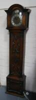 An early 20th century oak grandmother type clock