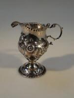 A George III silver helmet cream jug