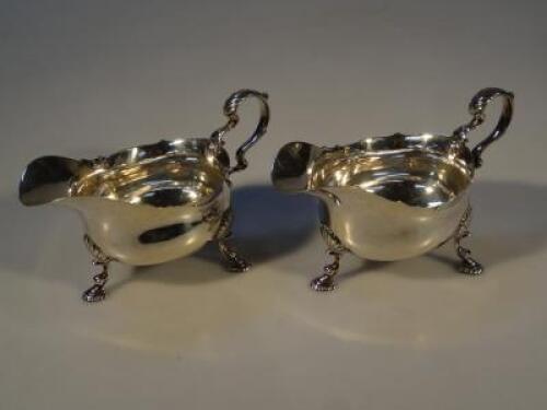 A pair of George VI silver sauce boats