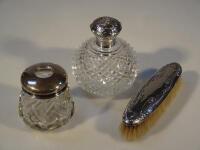 A Victorian style cut glass scent bottle