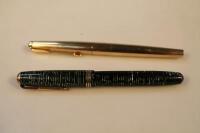 Two Parker fountain pens.