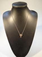 A 9ct gold elephant head pendant on chain stamped 375