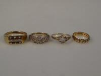 Four 9ct gold stone set dress rings