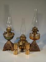 Three 19thC oil lamps and two brass lidded cups.