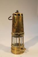 A 19thC brass miner's lamp stamped 2064