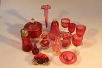 Various pieces of cranberry glass