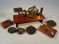 A Willis patent money weighing scales with weights.