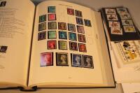 A stamp album and various other loose stamps