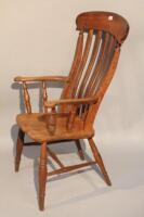 A 19thC beech and elm lath back grandfather chair.