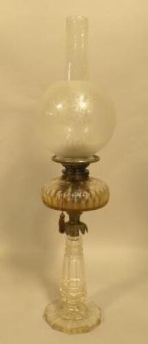 A Victorian cut glass and brass oil lamp