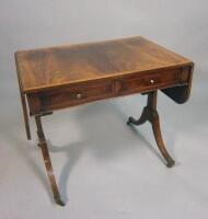 An early 19thC mahogany and satinwood crossbanded sofa table