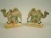 A pair of 19thC Staffordshire flatback camel figures