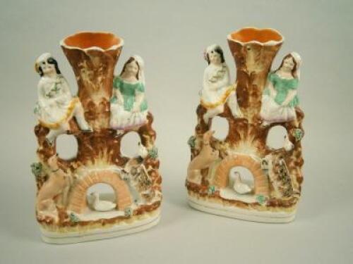 A pair of 19thC Staffordshire spill vases