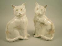 An unusual pair of 19thC Staffordshire seated cats