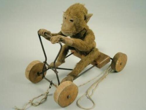 An unusual 20th century pull-a-long monkey