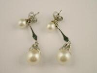 A pair of cultured pearl drop earrings