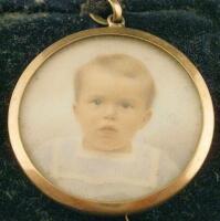 An early 20thC portrait miniature of a young boy