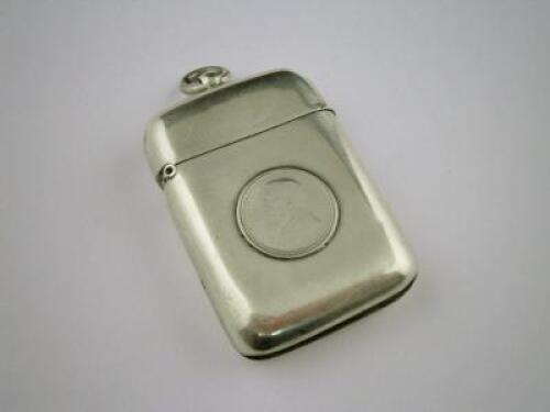 A silver vesta case