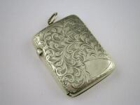 A silver vesta case