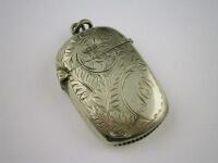 A silver vesta case