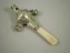 A late 19thC/early 20thC silver rattle