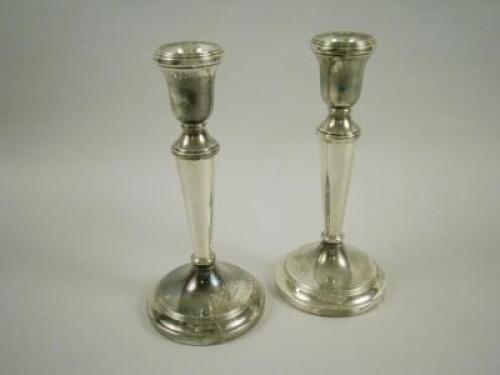 A pair of silver candlesticks