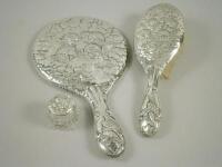 A silver mounted part dressing table set