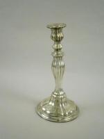 A Continental white metal candlestick