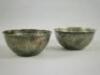 A pair of Middle Eastern silvered metal bowls